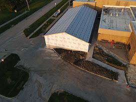 Building wrapped and roofed