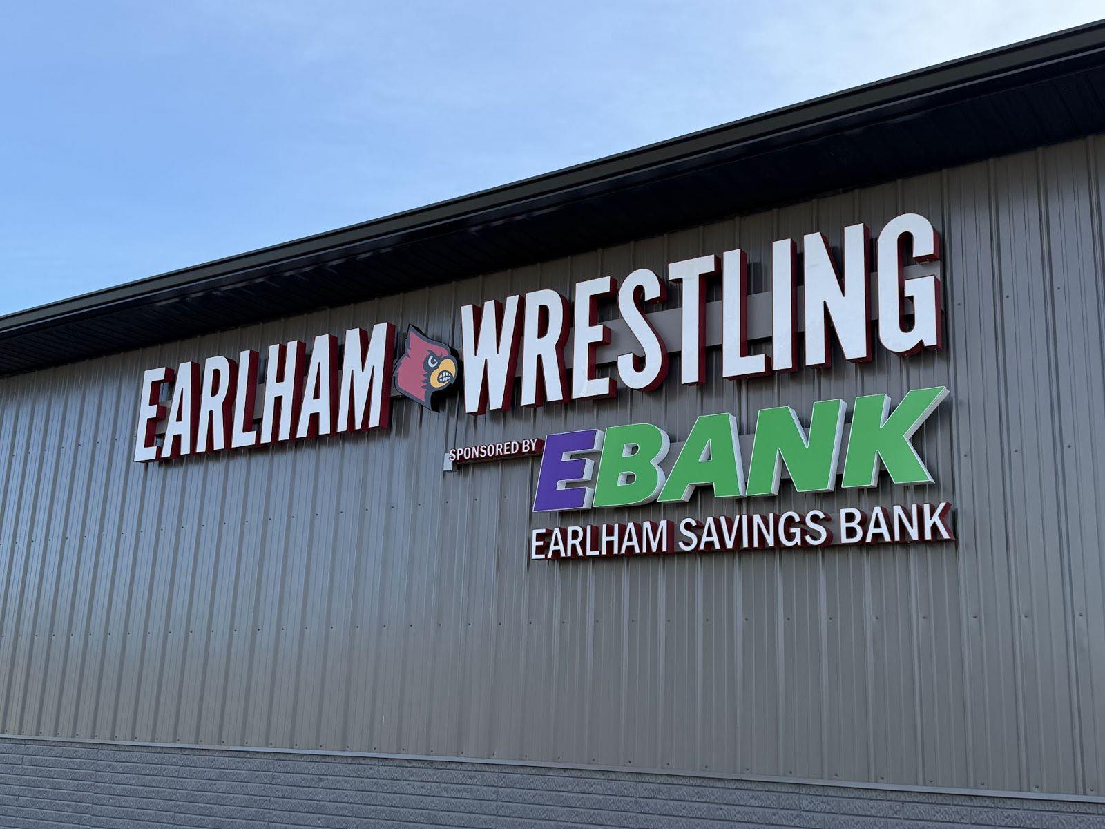 Earlham Wrestling sign sponsored by EBANK